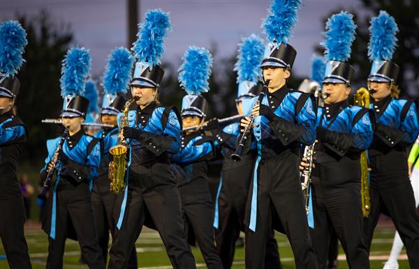 The Centennial High marching band performs